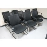 A set of nine Vector black armchairs on tubular metal legs