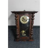 An Edwardian mahogany wall clock with brass and enamelled dial
