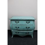 A contemporary painted three drawer bombe commode chest