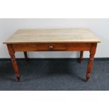 An antique pine farmhouse kitchen table fitted with a drawer CONDITION REPORT: