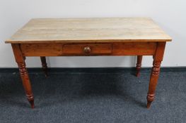 An antique pine farmhouse kitchen table fitted with a drawer CONDITION REPORT: