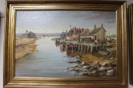 A gilt framed Denys Garle oil on canvas, Fishing village by an inlet,