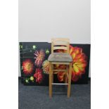 A contemporary bar stool together with three pieces of wall art - flowers