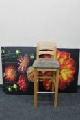 A contemporary bar stool together with three pieces of wall art - flowers