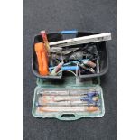 A cased Rubi tile cutter together with a plastic tub of assorted hand and power tools