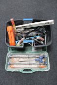 A cased Rubi tile cutter together with a plastic tub of assorted hand and power tools