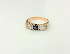 An antique 18ct gold sapphire and diamond three stone ring,