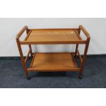 A mid century teak two tier tea trolley