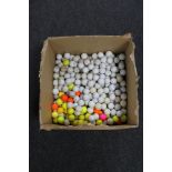 A box of a large quantity of golf balls