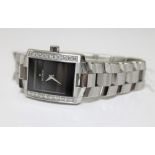 A Movado diamond set stainless steel wristwatch, set with approximately 1 carat of diamonds,