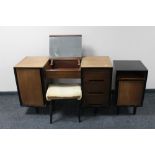 A mid century teak Stag knee hole dressing table and stool together with matching bedside cabinet