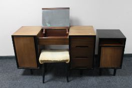 A mid century teak Stag knee hole dressing table and stool together with matching bedside cabinet