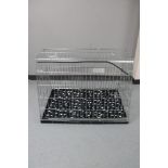 A folding metal dog cage,
