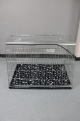 A folding metal dog cage,