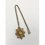 A silver gilt OBE pendant on chain