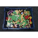 A box of early 20th century wooden jigsaw and toys