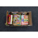 A box of Fisher Price music box record player together with a quantity of comics, cartoon books,