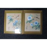 A pair of gilt framed Japanese watercolours of birds perched on branches,