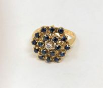 An 18ct gold sapphire and diamond cluster ring