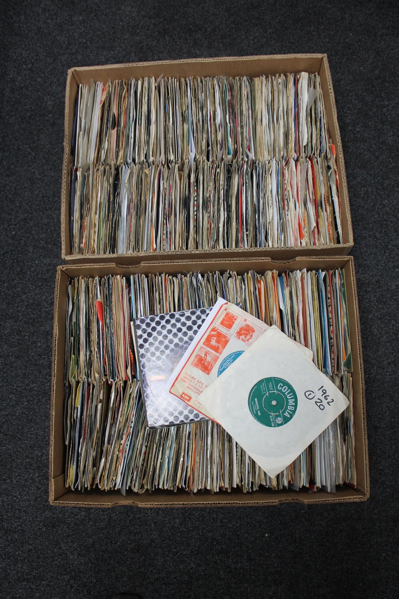 Two boxes of a large quantity of vinyl 7" singles, The Clash, Foo Fighters,