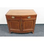 A Victorian inlaid mahogany bow fronted cabinet with two drawers