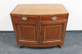 A Victorian inlaid mahogany bow fronted cabinet with two drawers