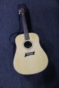 A Michael Kelly semi acoustic guitar in carry bag