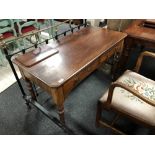 A Victorian mahogany two drawer side table on reeded legs