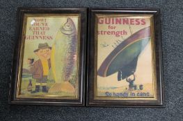 A pair of framed Guinness advertising prints