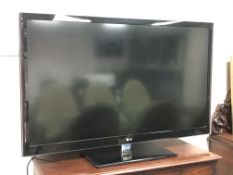 An LG 55 inch 3D Smart TV model number 55LW550T with remote control.