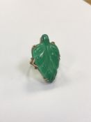 A gold mounted jade ring, size Q1/2 CONDITION REPORT: 8.