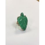 A gold mounted jade ring, size Q1/2 CONDITION REPORT: 8.