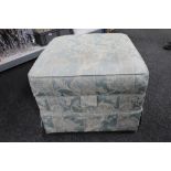 An upholstered storage stool