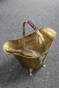 A Victorian brass coal bucket with shovel