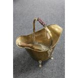 A Victorian brass coal bucket with shovel