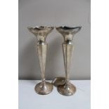 A pair of silver fluted vases with weighted bases - Chester 1924