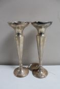 A pair of silver fluted vases with weighted bases - Chester 1924