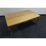 A French style oak coffee table