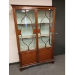 A late Victorian inlaid mahogany display cabinet,