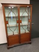 A late Victorian inlaid mahogany display cabinet,