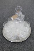 A lead crystal whisky decanter and six glasses on circular tray