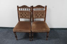 A pair of carved Edwardian dining chairs in brown dralon