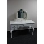 A contemporary white French style kneehole dressing table with triple mirror
