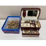 A leather jewellery box together with a further box containing costume jewellery, necklaces,