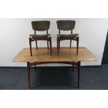 A mid century Dalescraft rectangular teak dining table and two teak chairs