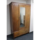 An Edwardian mahogany mirror door wardrobe