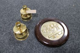A pair of brass trench art candlesticks,