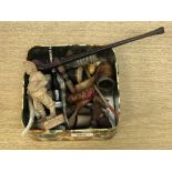A tin of antique pipes, Black Forest style carved figure,