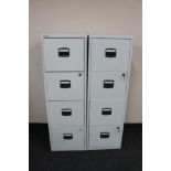 A Bisley four drawer metal filing cabinet with keys and one further cabinet