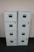 A Bisley four drawer metal filing cabinet with keys and one further cabinet